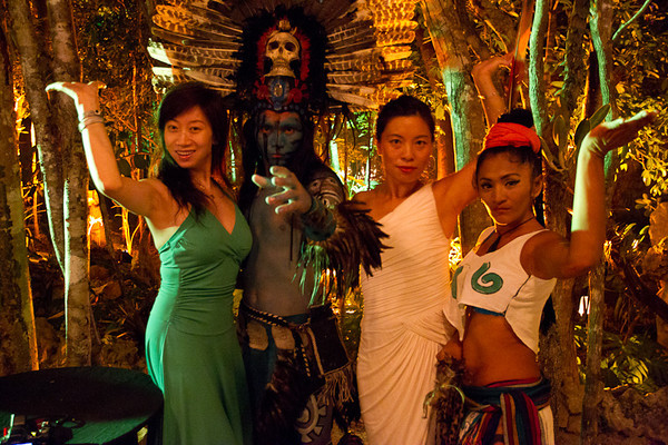 Associates pose with the Mayan performers