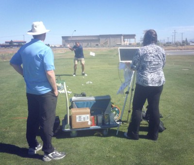 Tom and Lorie Mulhern help USANA CCO Dan Macuga with his golf swing.