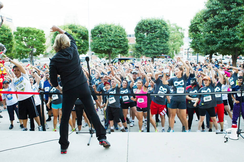 Kathy Kaehler warming up the 5k runners.