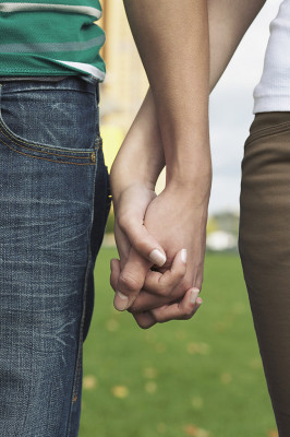 Young couple holding hands