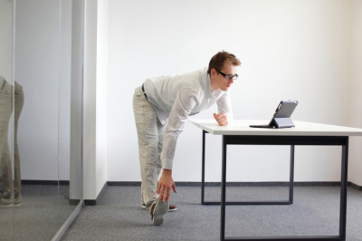 Man Stretching at Work