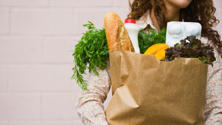 Woman carrying a bag of groceries