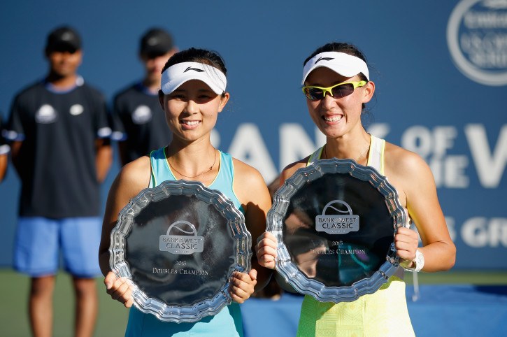 STANFORD, CA - AUGUST 09: (L-R) Yi-Fan Xu and Saisai Zheng of China hold up their trophies after they beat Anabel Medina Garrigues and Arantxa Parra Santonja of Spain in the doubles finals on Day 7 of the Bank of the West Classic at Stanford University Taube Family Tennis Stadium on August 9, 2015 in Stanford, California. (Photo by Ezra Shaw/Getty Images)