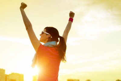 Woman cheering with arms