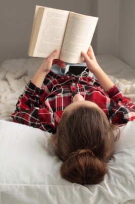 Teenager reading a book