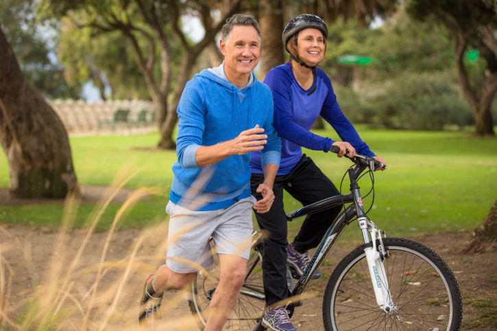 Elder couple exercising in the park