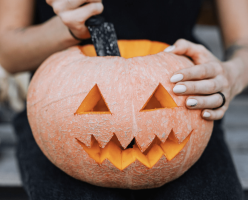 Woman Carving Jack-o’-Lantern Halloween