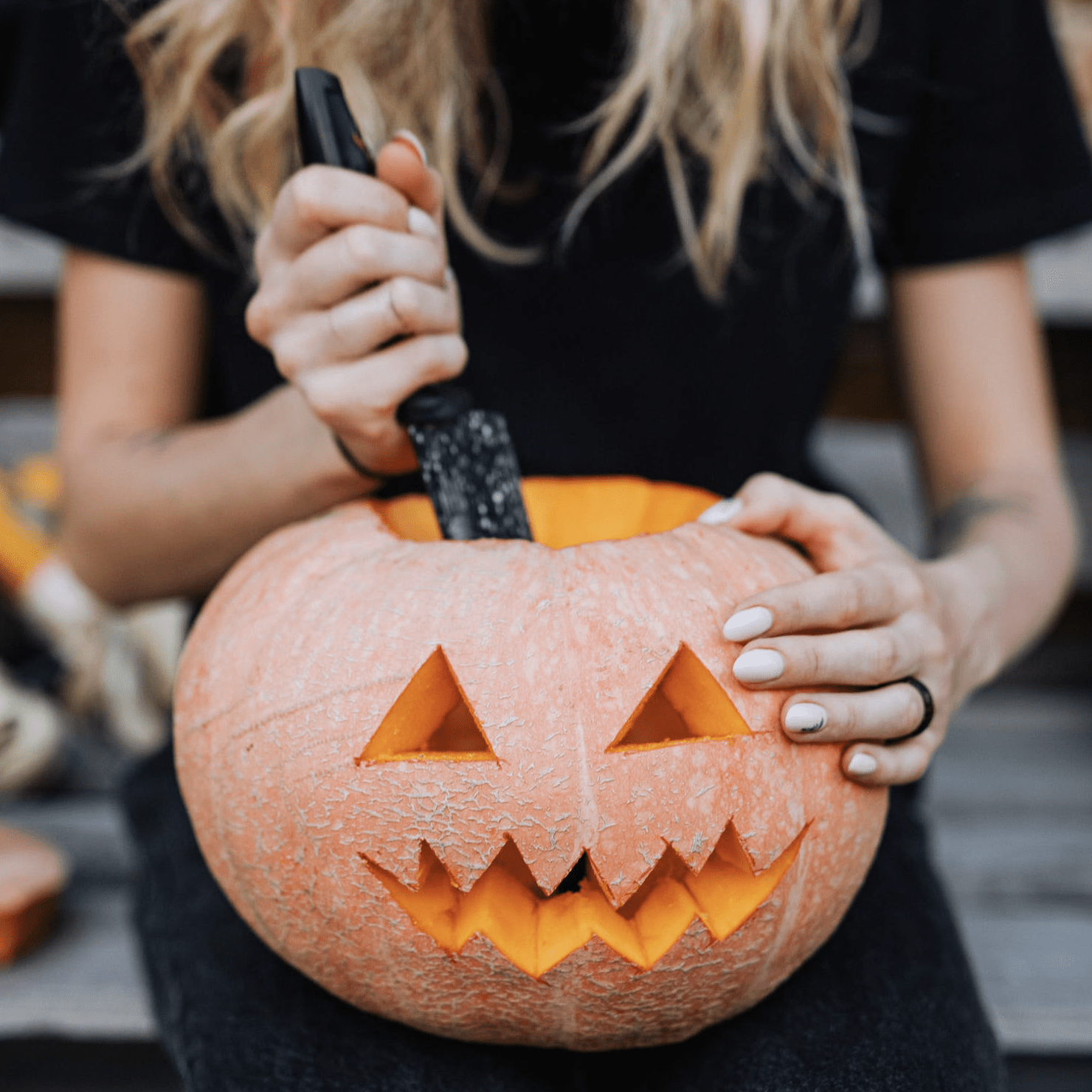 Woman Carving Jack-o’-Lantern Halloween